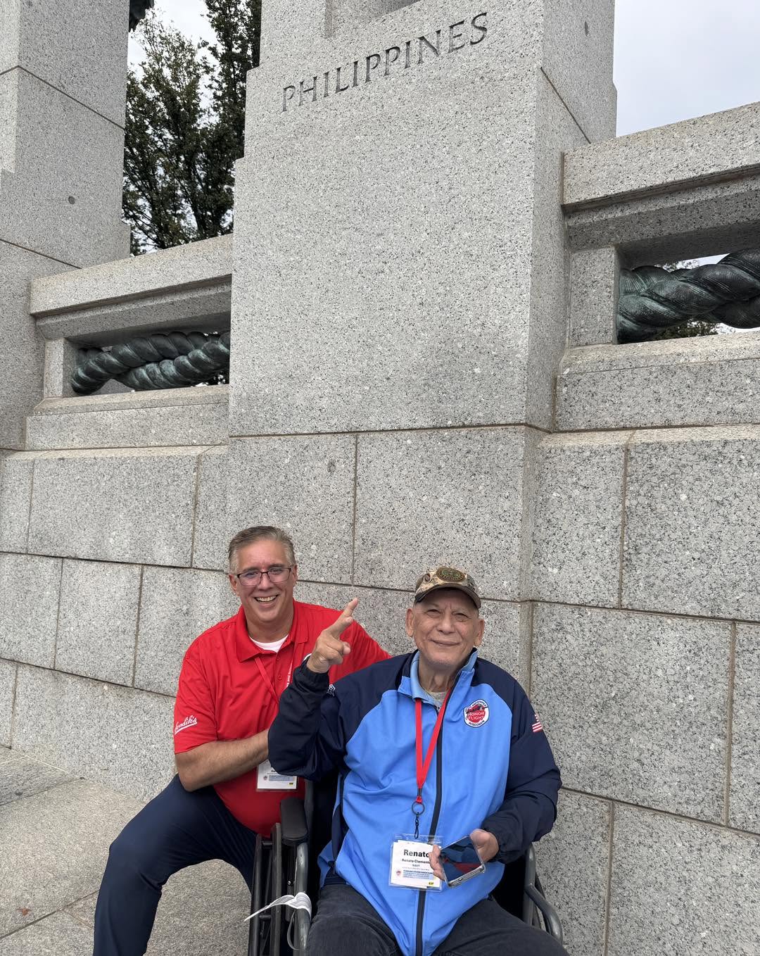 A veteran and guardian beside the Philippines pillar.
