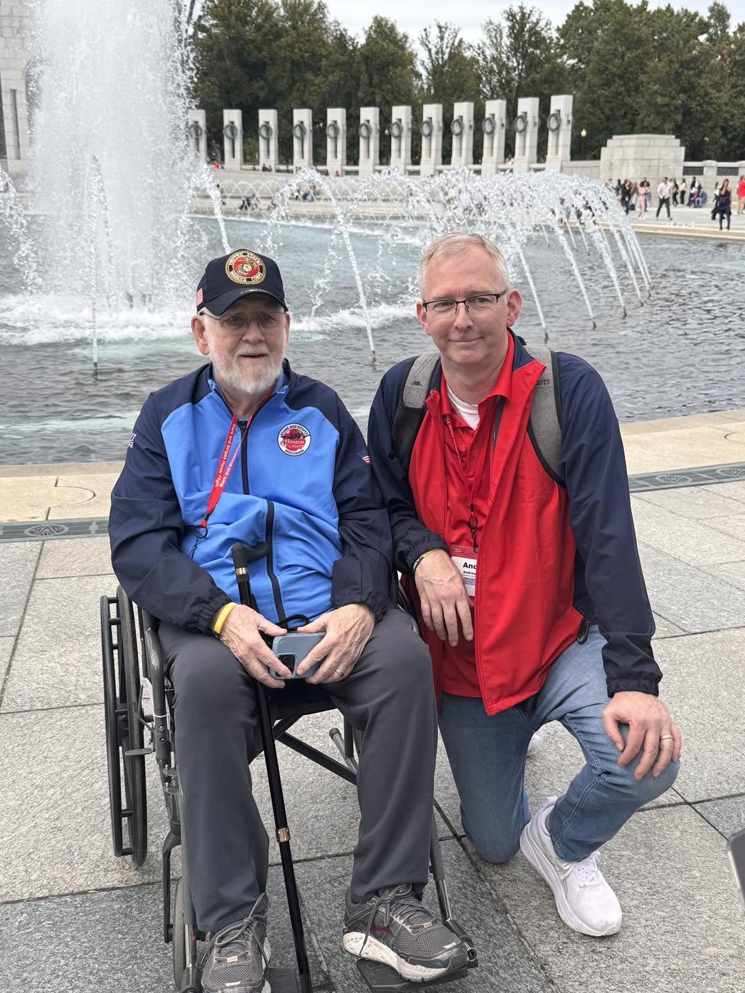 A shared moment beside the memorial fountains.