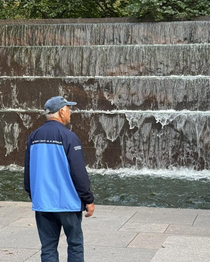 Taking a moment to enjoy the memorial’s waterfall.