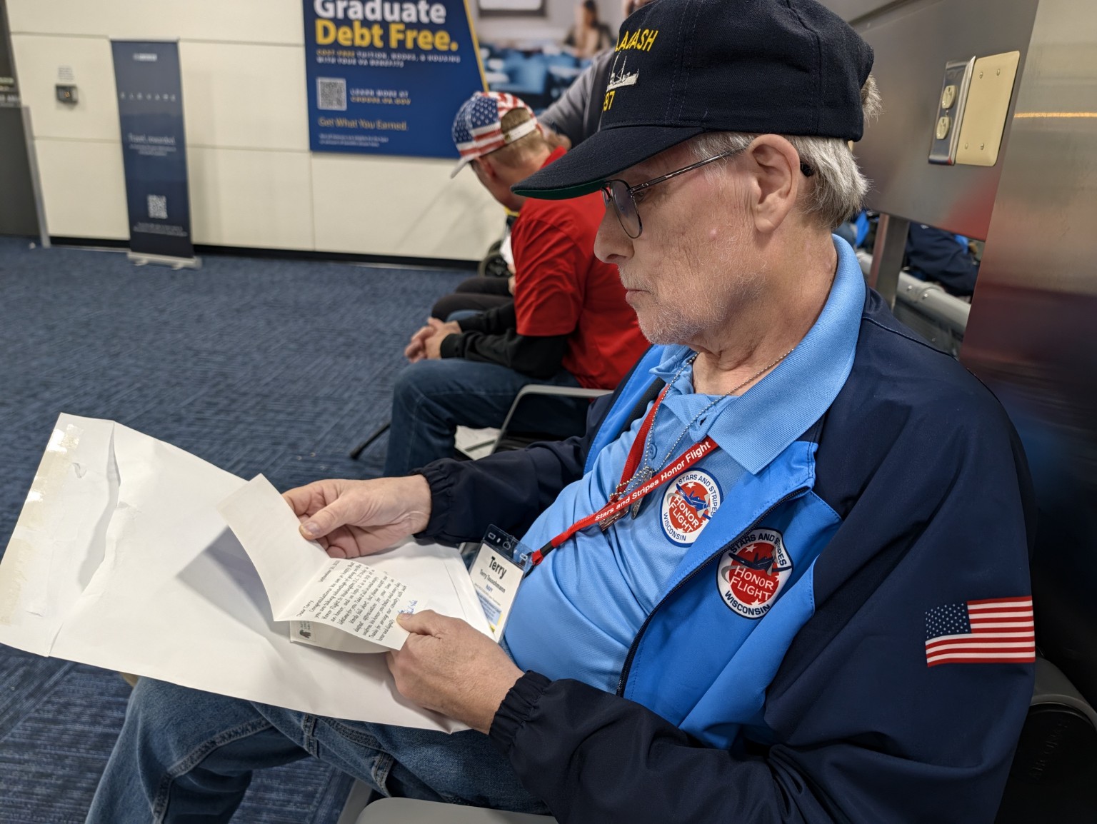 Dad, Terry, reading his mail call letters at the end of the day.