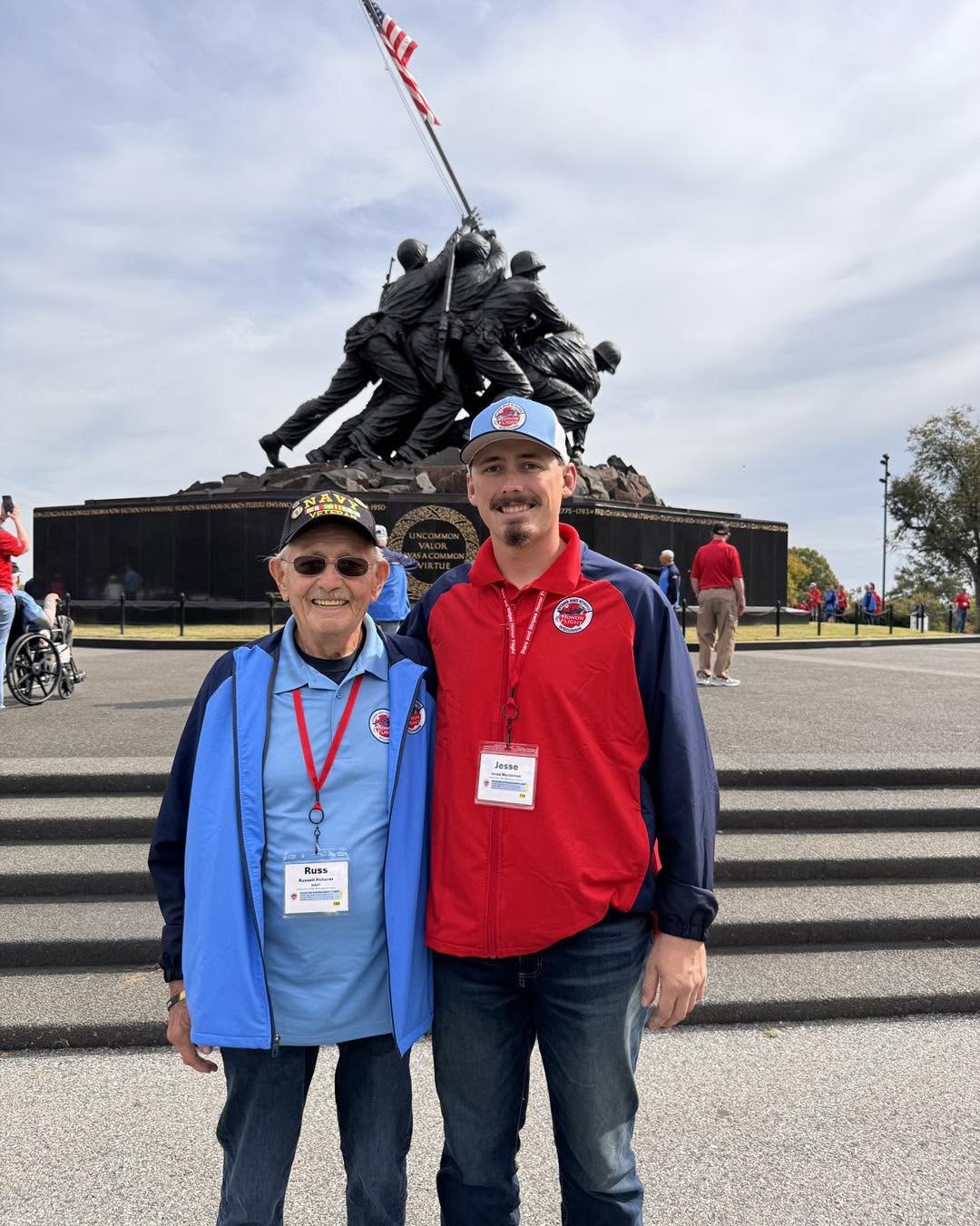A veteran and guardian together in front of the Iwo Jima memorial.