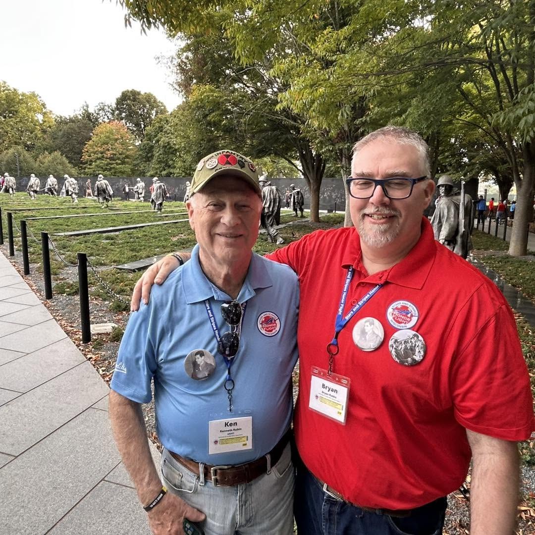 An Alpha veteran and guardian near the Korean War Veterans Memorial’s statues.