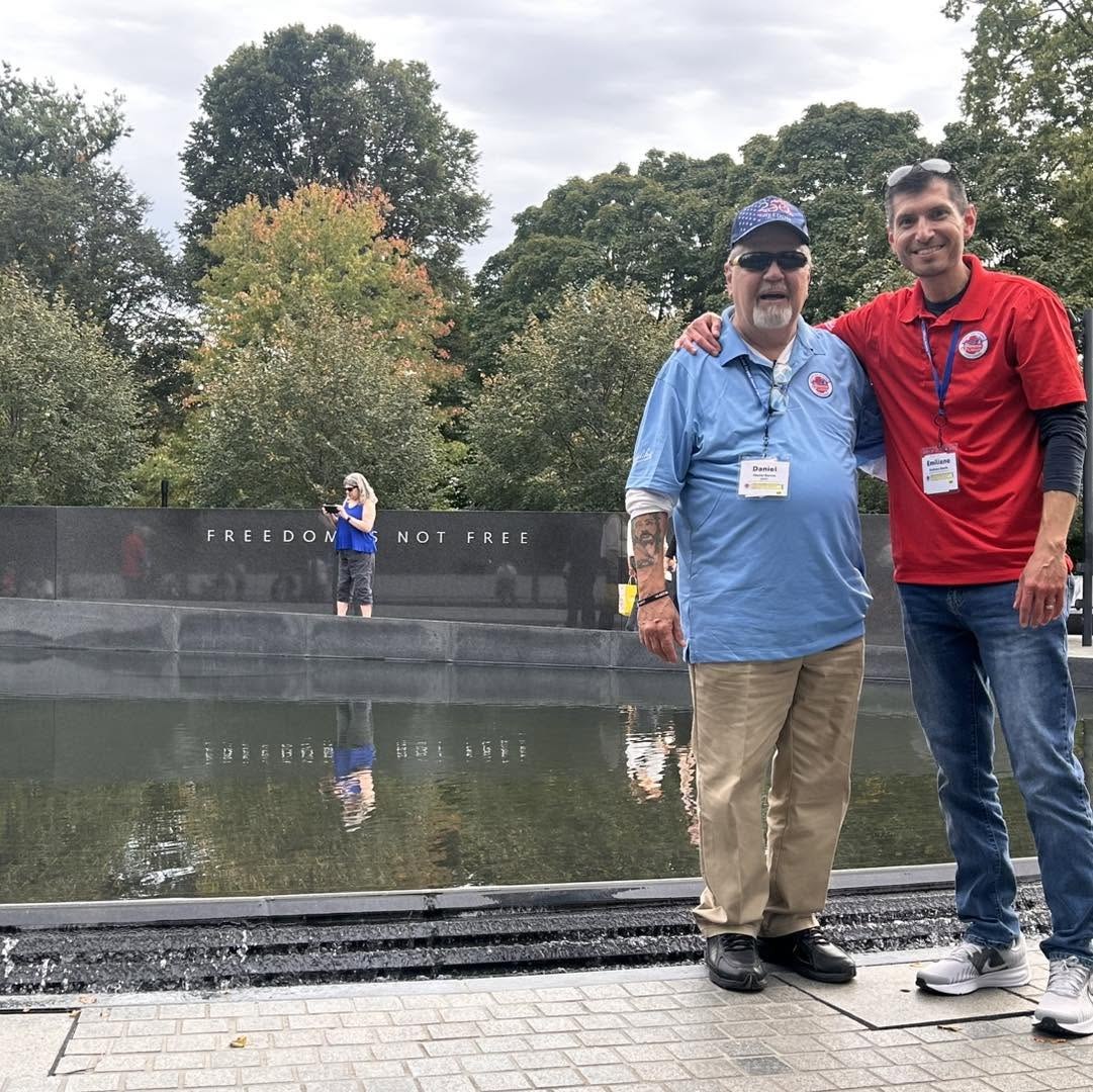 An Alpha veteran and guardian beside the Korean War Memorial’s Pool of Remembrance.
